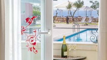 Double Room, Balcony, Sea View | Minibar, in-room safe, desk, laptop workspace