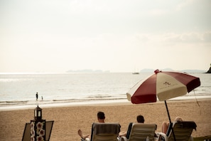 On the beach, sun loungers, beach umbrellas, beach towels