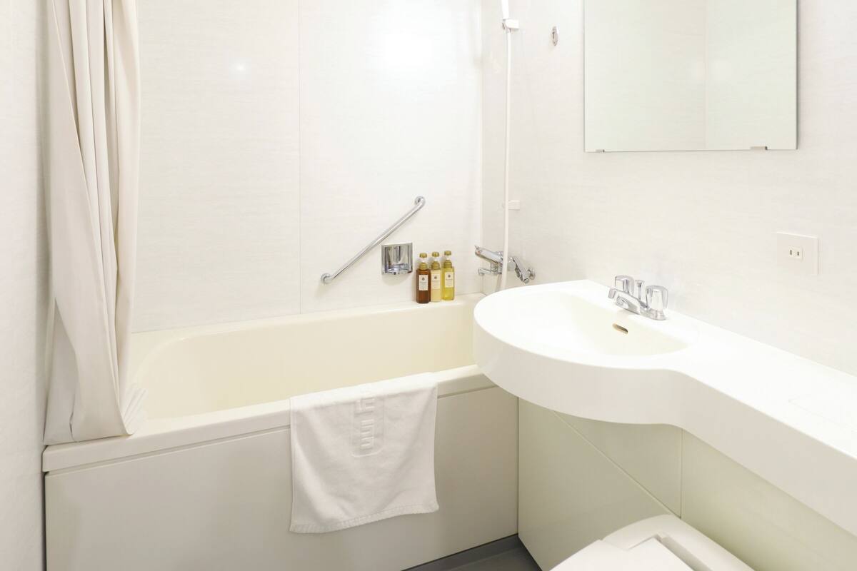 shower, rainfall showerhead, hair dryer, slippers