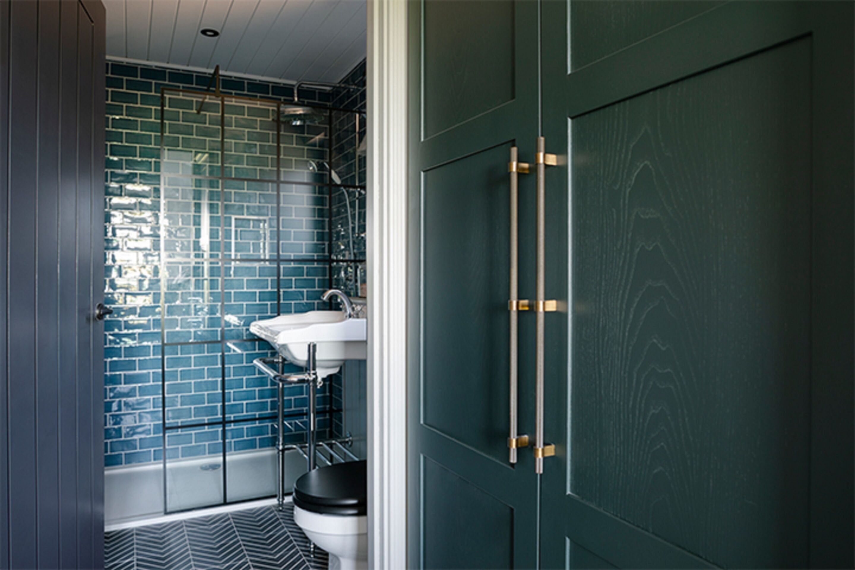 A bathroom with a shower, toilet, and sink.