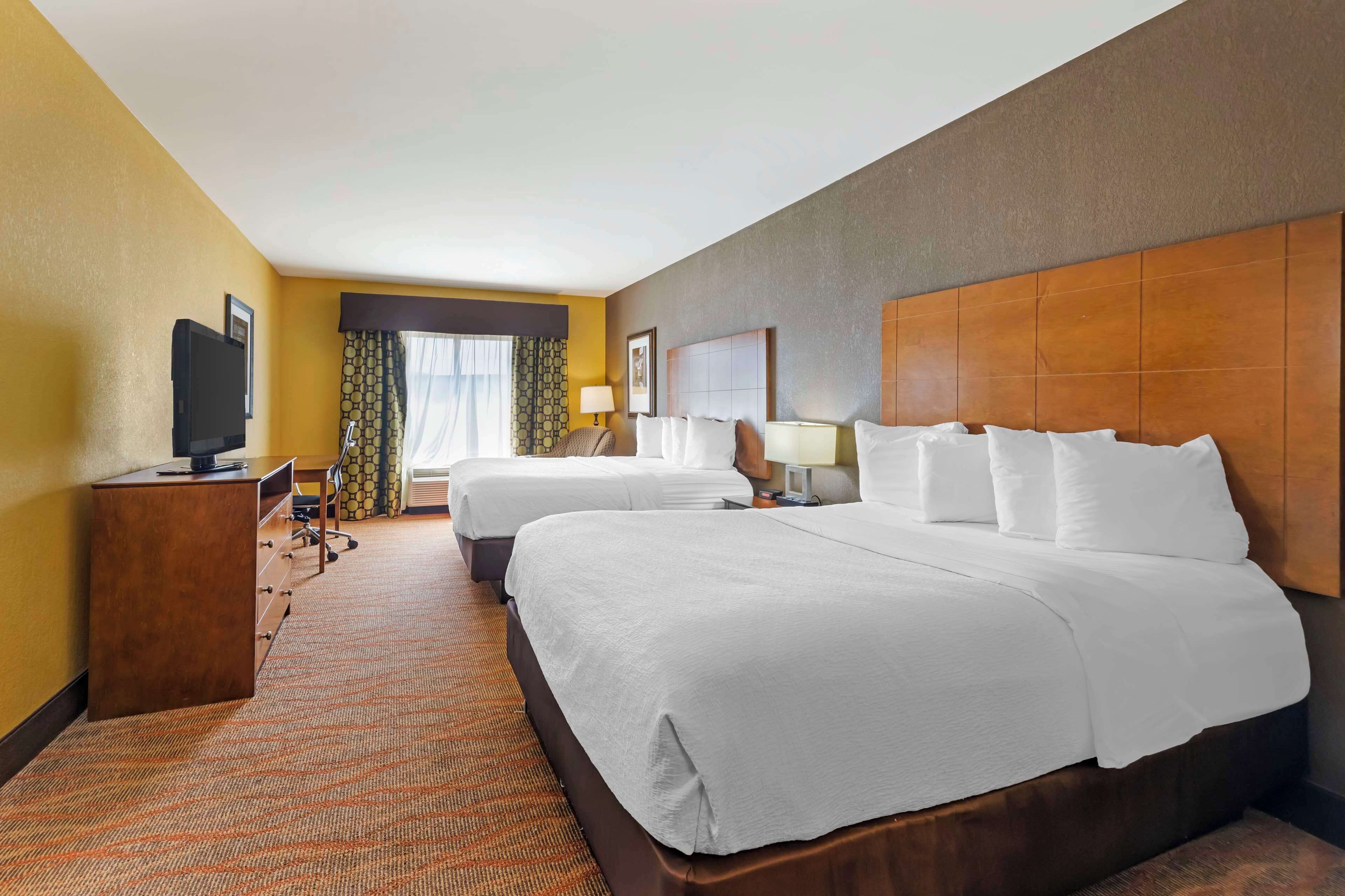 pillow-top beds, desk, laptop workspace, iron/ironing board