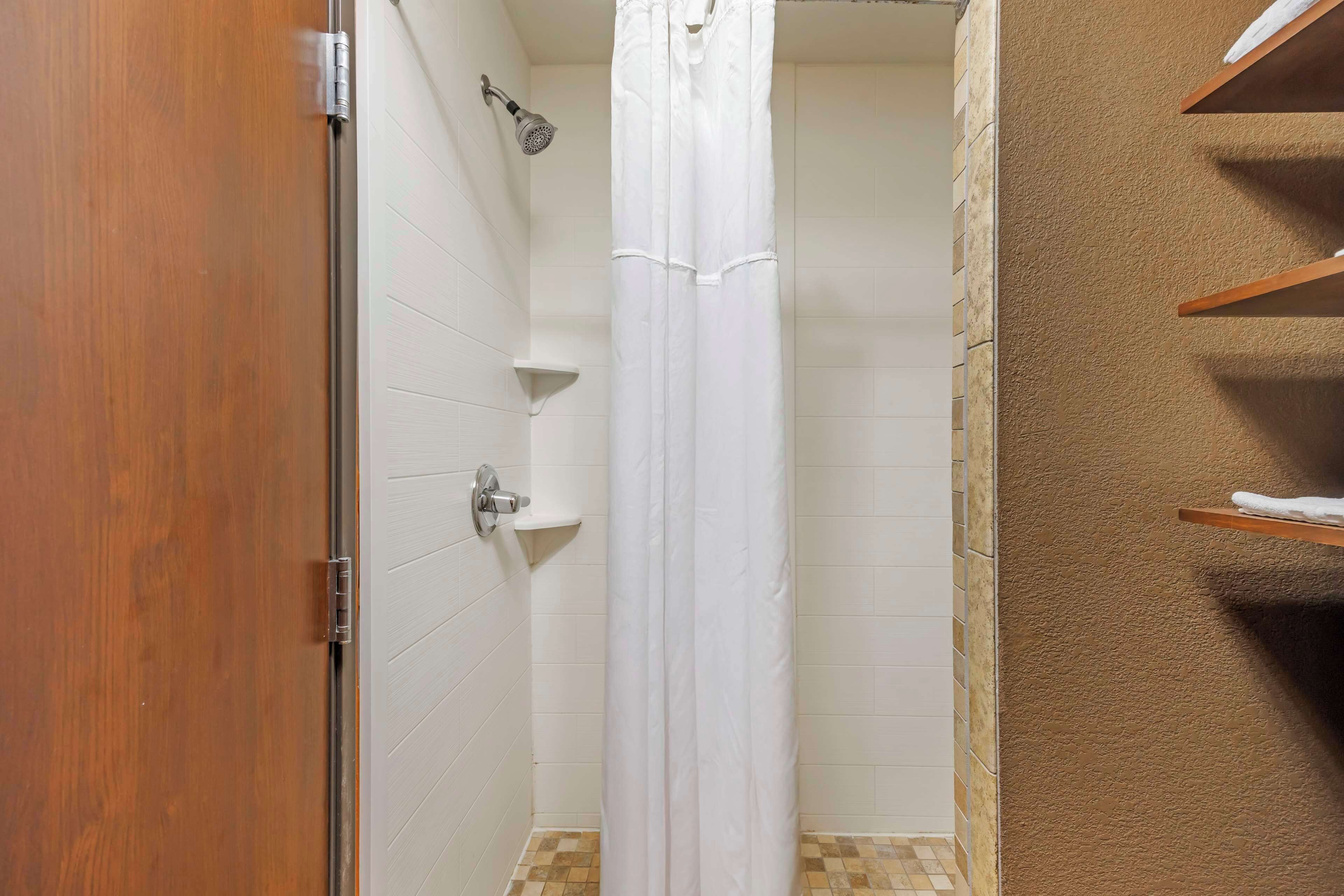 standard room, 1 king bed, non smoking, refrigerator & microwave | bathroom | free toiletries, hair dryer, towels