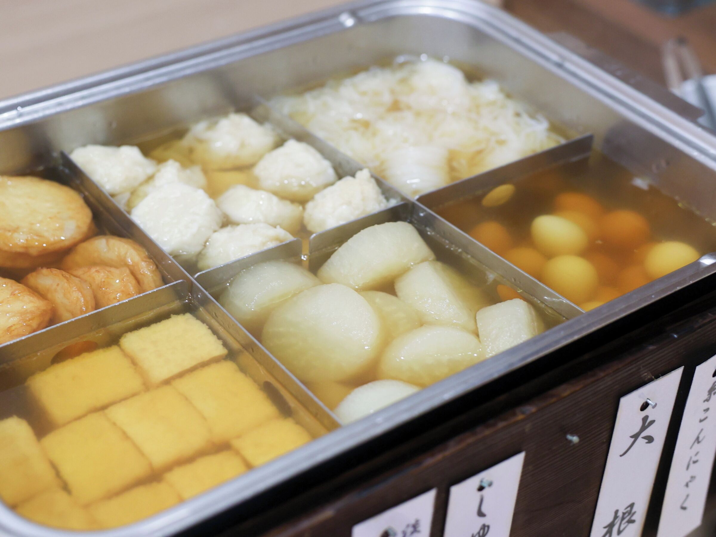 A food display with various items in separate compartments.
