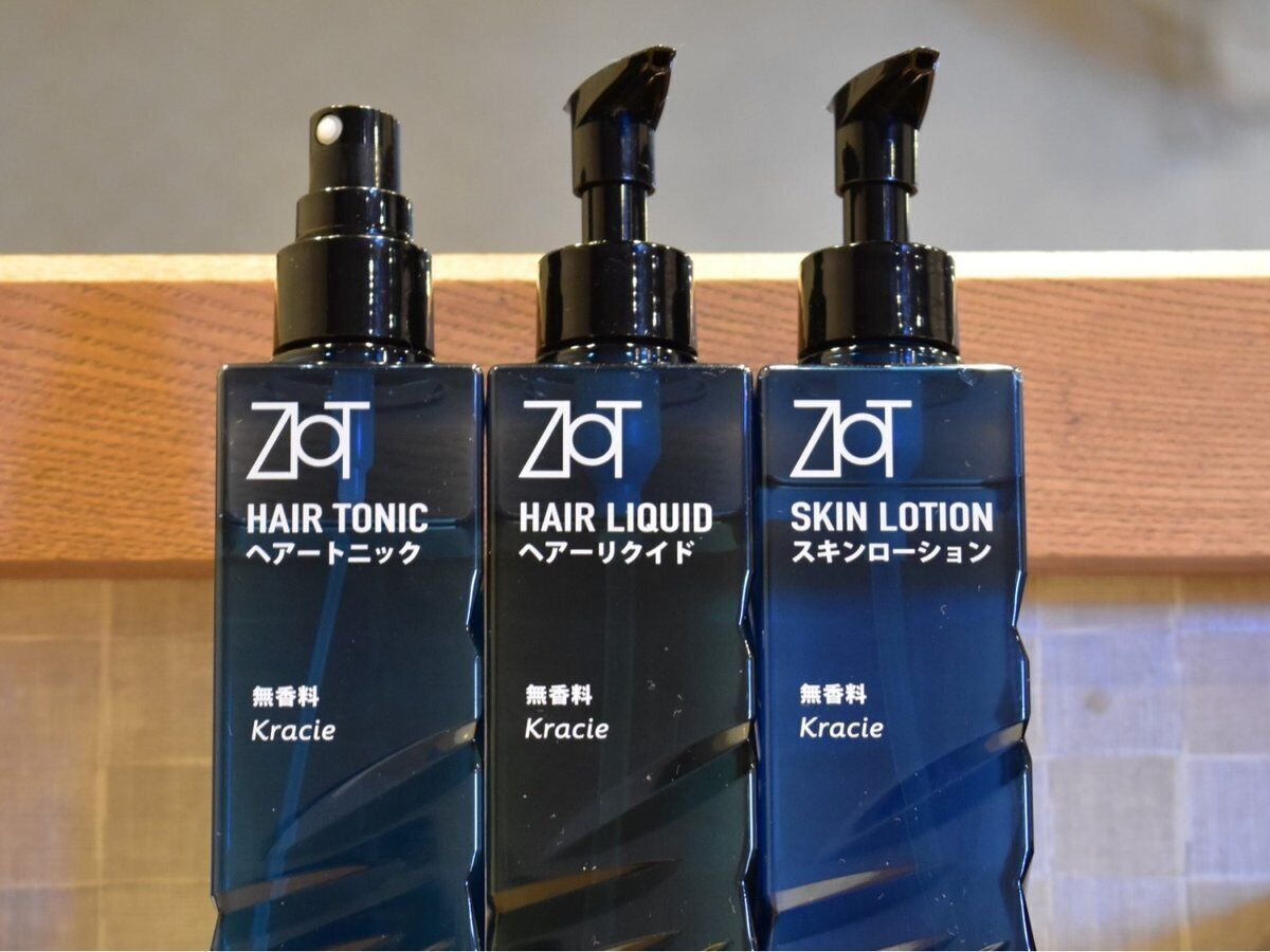 Three bottles of hair care products labeled 'Kracie' in both English and Japanese.