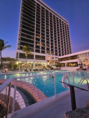 Outdoor pool, open 8:00 AM to 10:00 PM, pool umbrellas, pool loungers