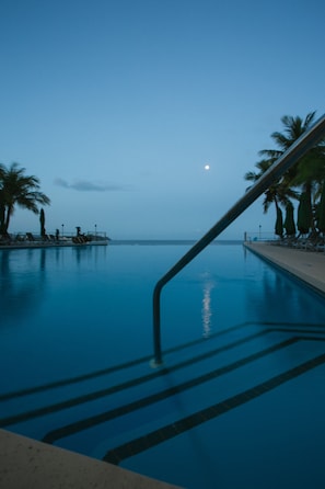Outdoor pool, open 8:00 AM to 10:00 PM, pool umbrellas, sun loungers