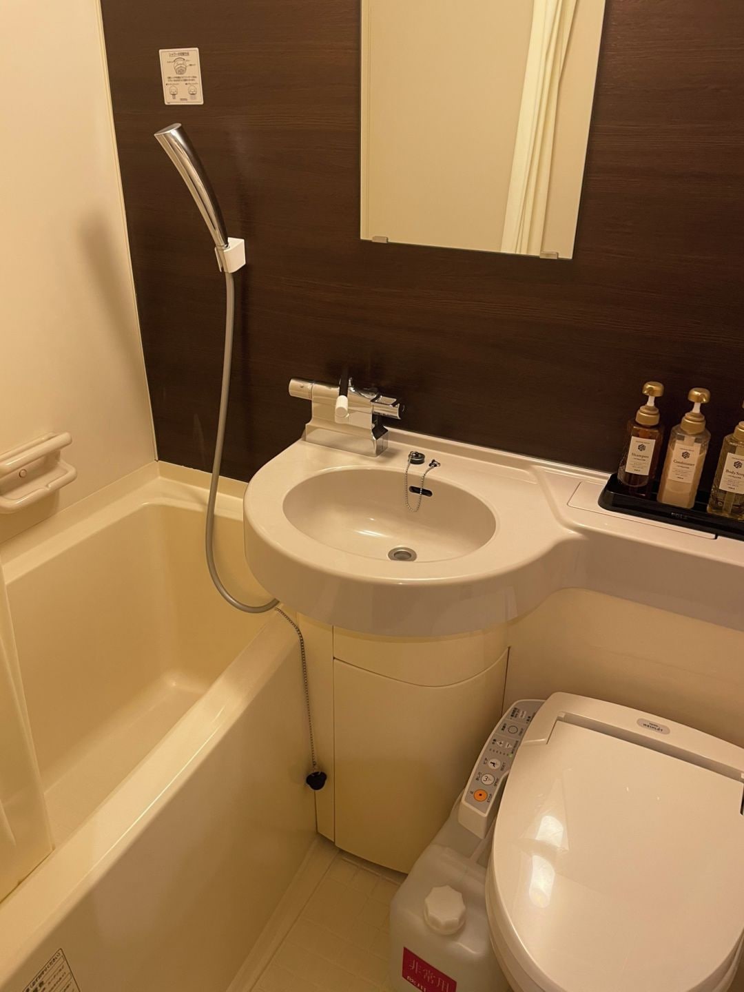 A bathroom with a bathtub, sink, and toilet.