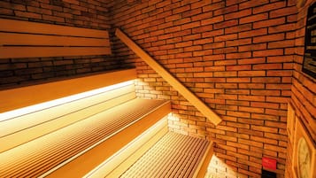 A staircase with wooden steps and a brick wall.