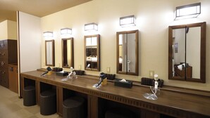 A public restroom with multiple sinks, mirrors, and hair dryers. - Dormy Inn Premium Otaru Natural Hot Spring (Otaru)