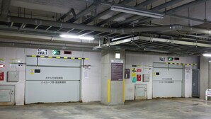 A parking garage with two doors labeled 'No.1' and 'No.2,' each with a green light indicating they are open. - Dormy Inn Premium Otaru Natural Hot Spring (Otaru)