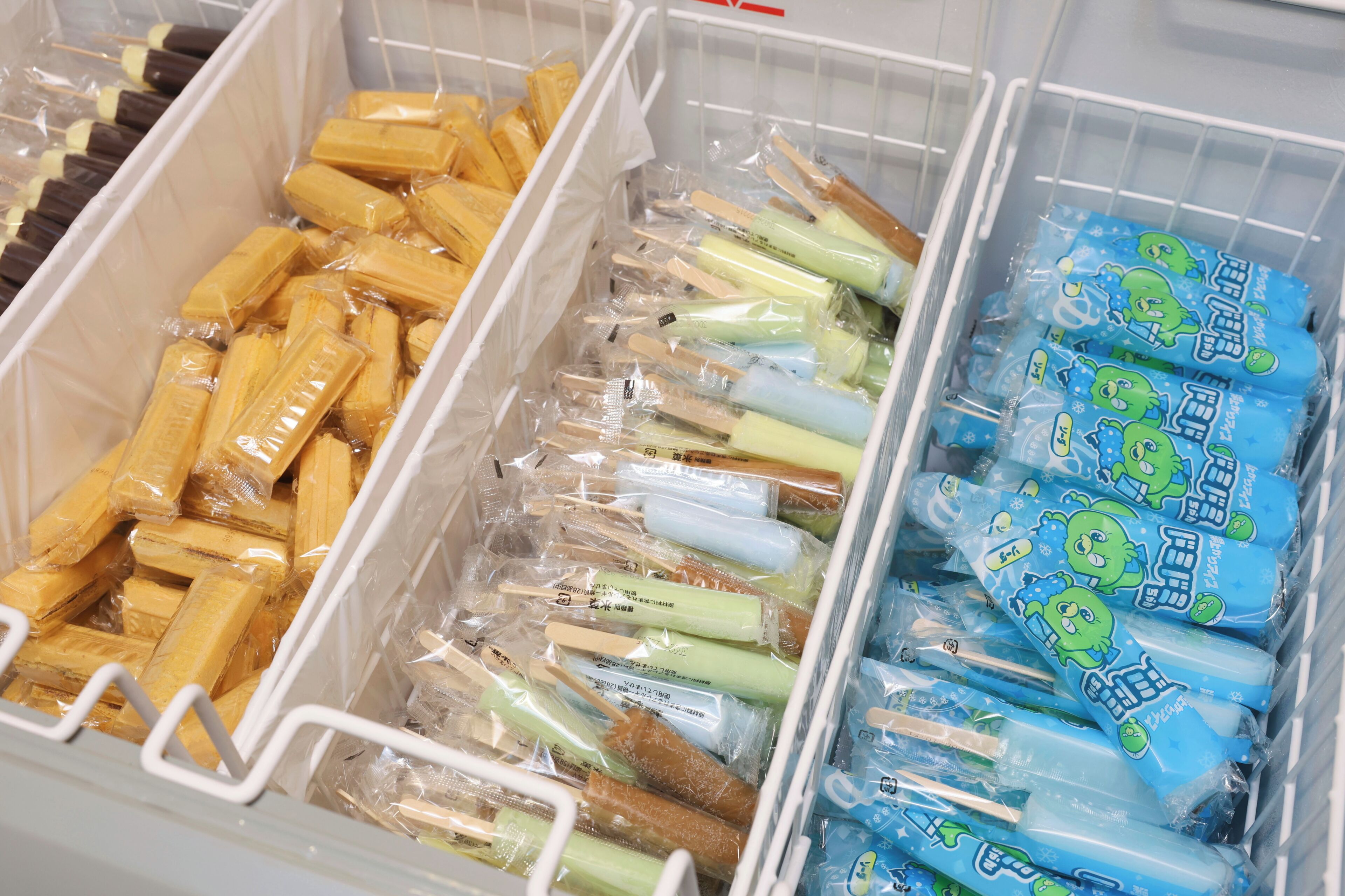 Storage bins containing packaged food items.