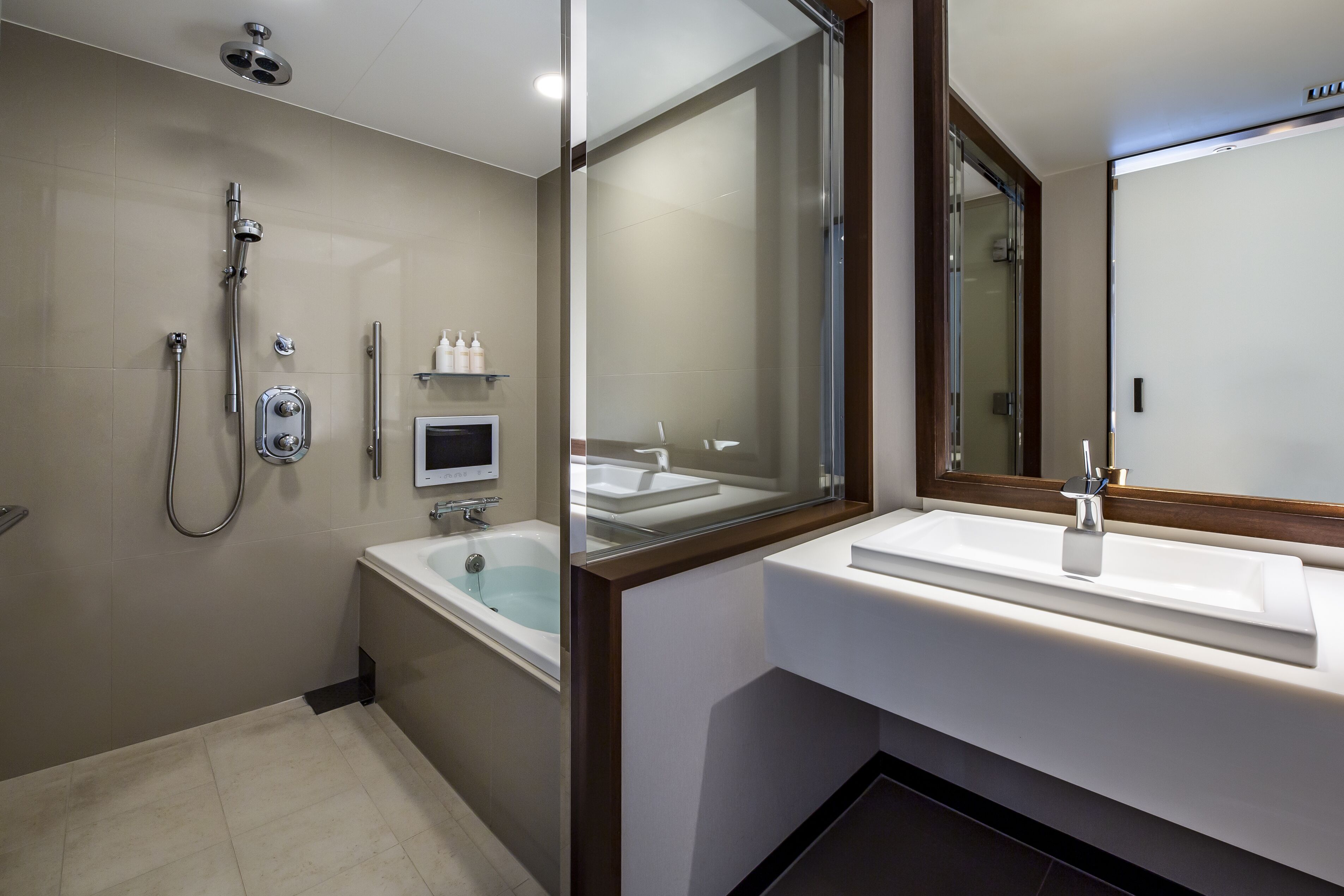 junior suite, non smoking (premium floor) | bathroom | combined shower/bathtub, eco-friendly toiletries, hair dryer, slippers