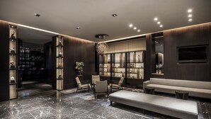 A modern lobby with marble flooring, a seating area with sofas and chairs, and a decorative wall with shelves. - The Royal Park Hotel Kyoto Sanjo (Kyoto)