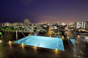 Outdoor pool, open 7:00 AM to 7:00 PM, pool umbrellas, sun loungers at  Ciqala Suites Hotel