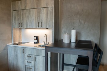 Suite, 1 Bedroom | Private kitchenette | Microwave, coffee/tea maker at  Ciqala Suites Hotel