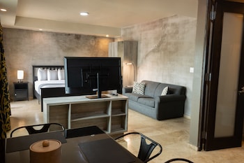 Luxury Studio Suite, 1 Queen Bed | Living area | LCD TV at  Ciqala Suites Hotel