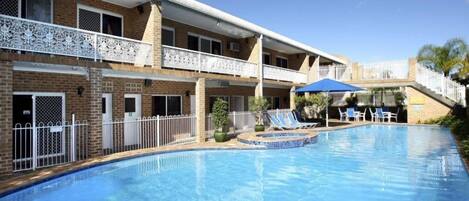 Outdoor pool, pool umbrellas, sun loungers