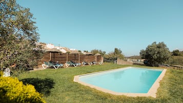 Seasonal outdoor pool, pool loungers