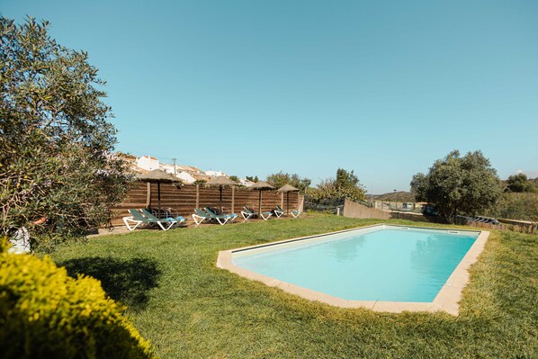 Seasonal outdoor pool, pool loungers