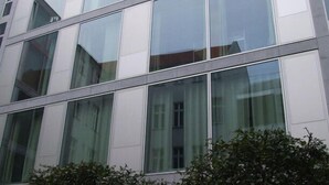 A modern building with large glass windows and a symmetrical facade. - Heart of Gold Hostel Berlin (Berlin)