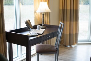 Suite, 1 King Bed, Non Smoking, Ground Floor | Desk, blackout curtains, iron/ironing board, cots/infant beds - Days Inn by Wyndham Montmagny (Montmagny)