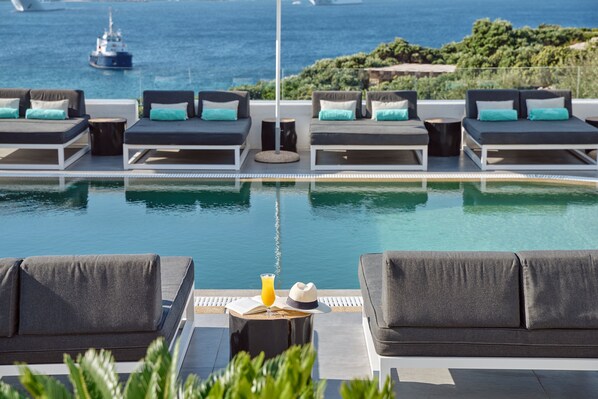 Seasonal outdoor pool, free pool cabanas, pool umbrellas