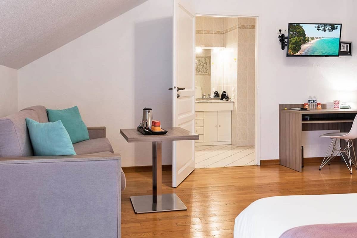 family room, jetted tub | desk, blackout curtains, soundproofing, iron/ironing board