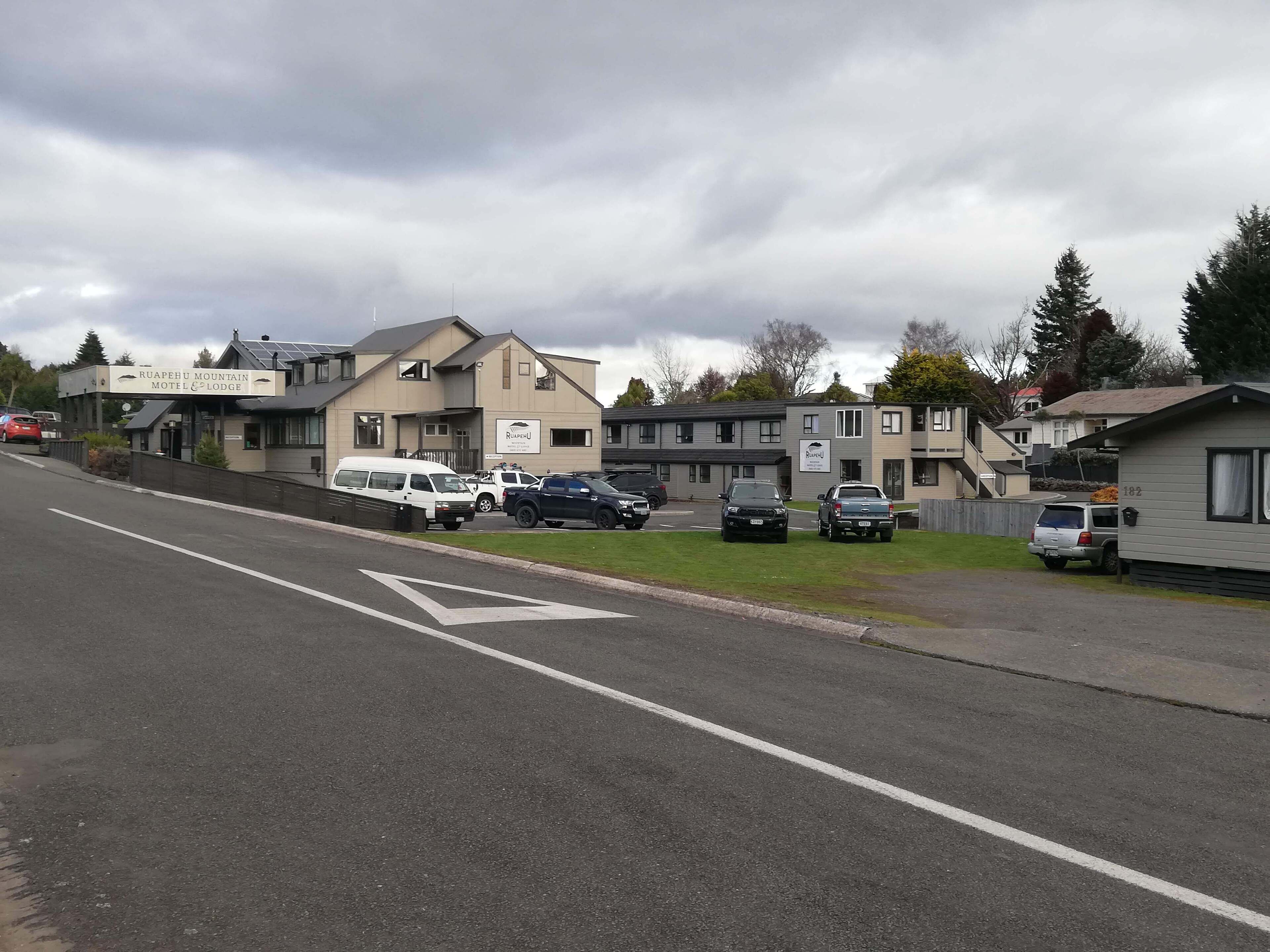 A motel with a sign reading "Ruapehu Mountain Motel & Lodge".