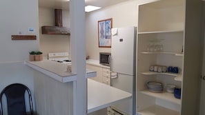 Chalet, 4 Bedrooms | Private kitchen | Fridge, coffee/tea maker, electric kettle, highchair