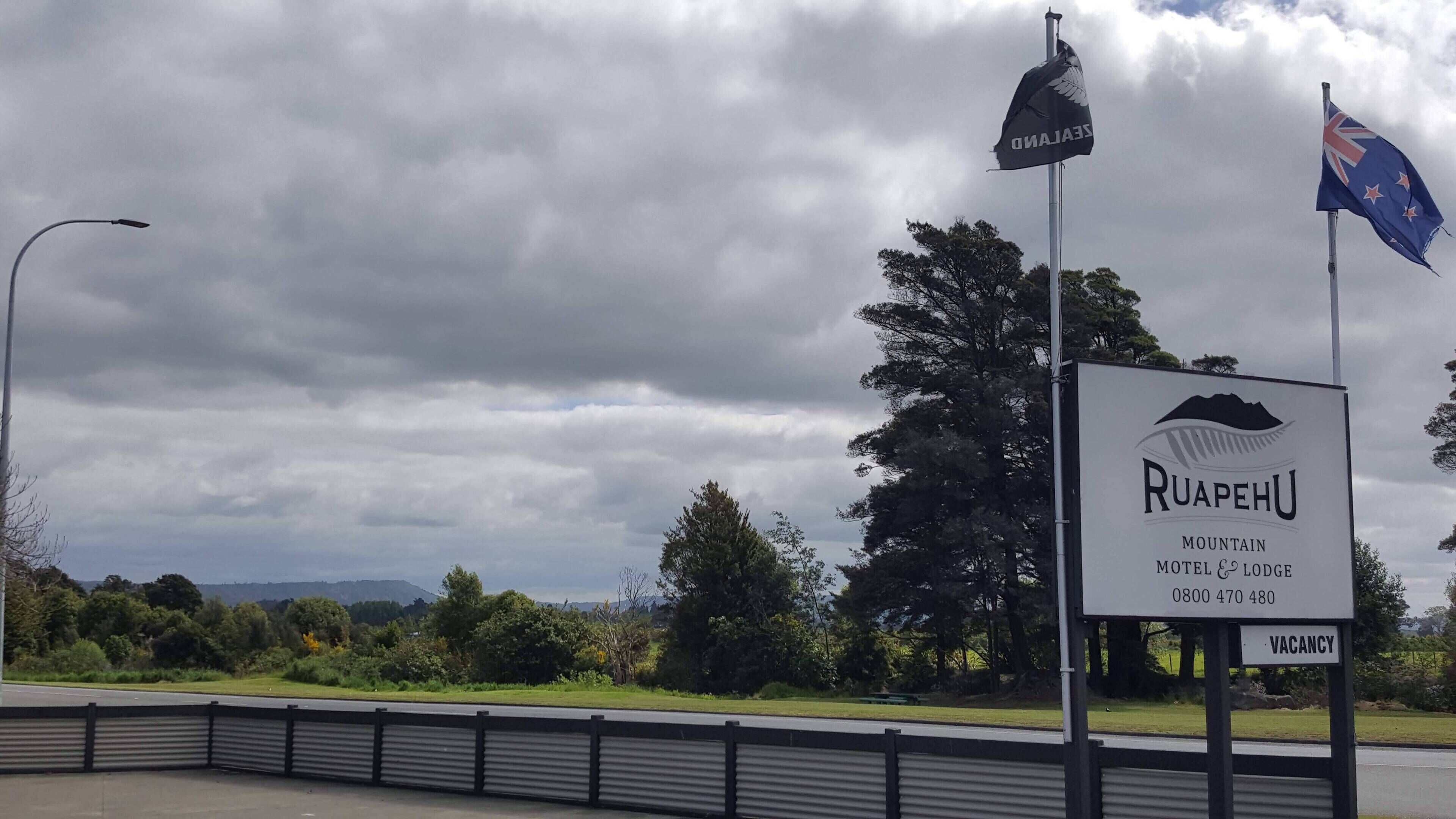 A signboard for Ruapehu Mountain Hotel & Lodge with a 'VACANCY' label.