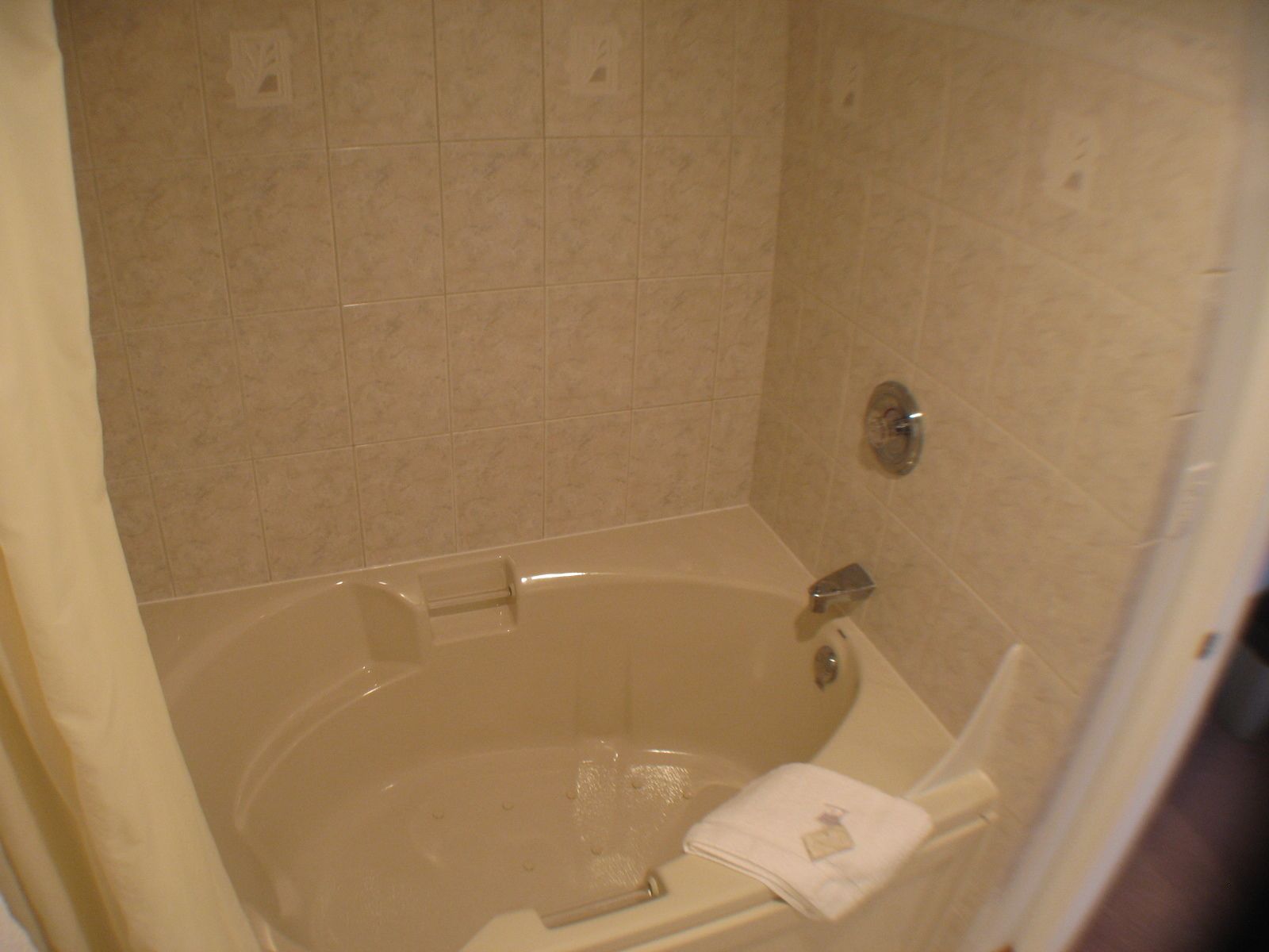 A bathroom with a bathtub, a shower, and a toilet.