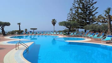 Outdoor pool, pool umbrellas, sun loungers