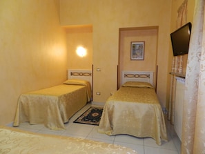 Standard Triple Room | 1 bedroom, down comforters, desk, iron/ironing board