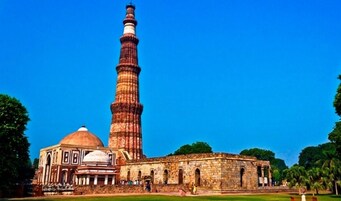 A historic building with a prominent minaret and a dome.