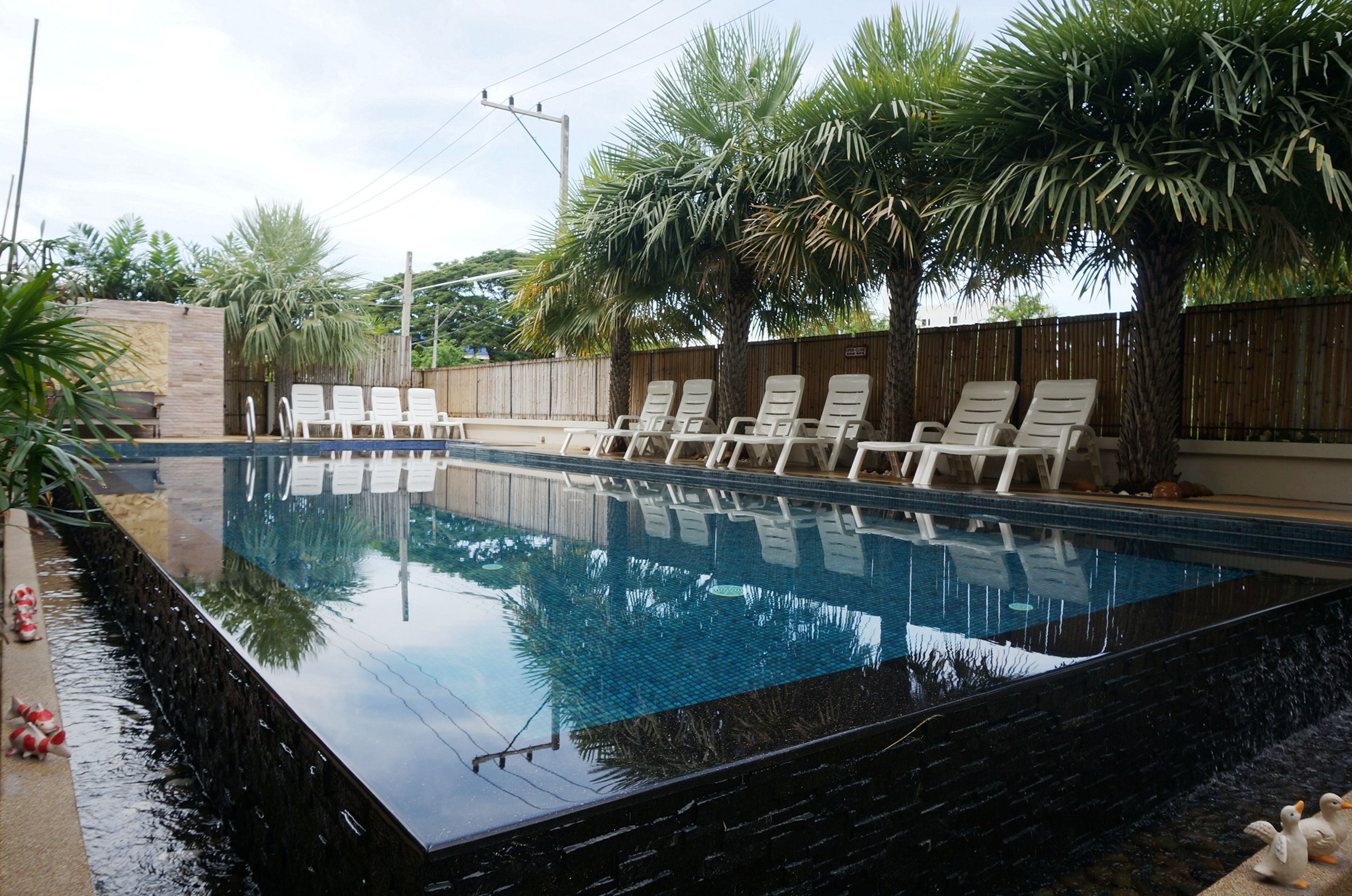 outdoor pool, open 7:00 am to 8:00 pm, pool loungers