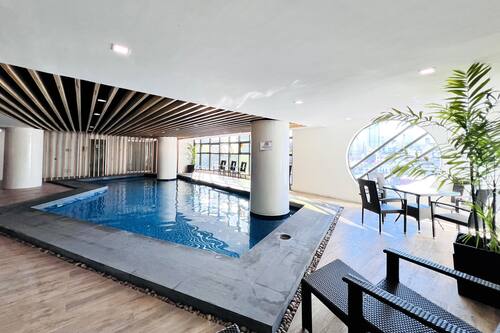 Indoor pool, open 8:00 AM to 7:00 PM, pool loungers