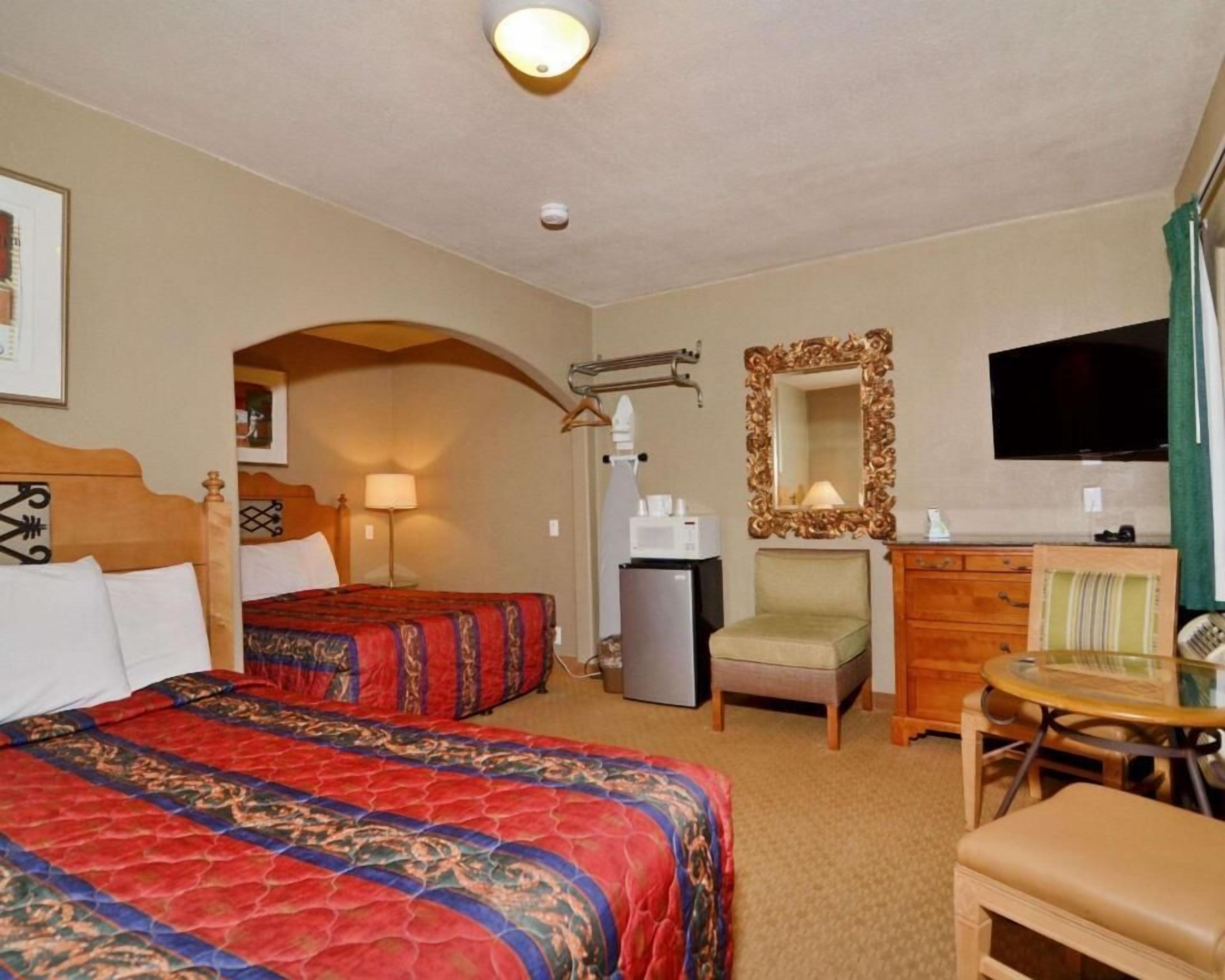Desk, blackout drapes, iron/ironing board, bed sheets