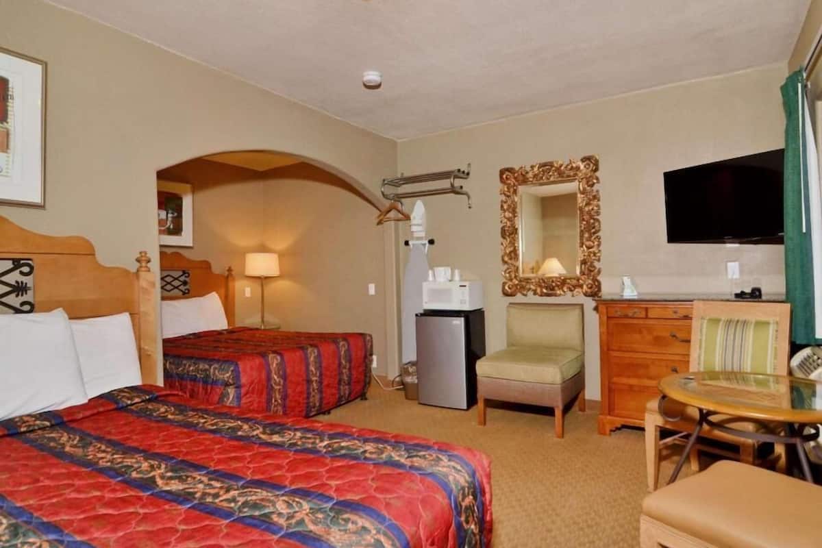 Desk, blackout drapes, iron/ironing board, bed sheets