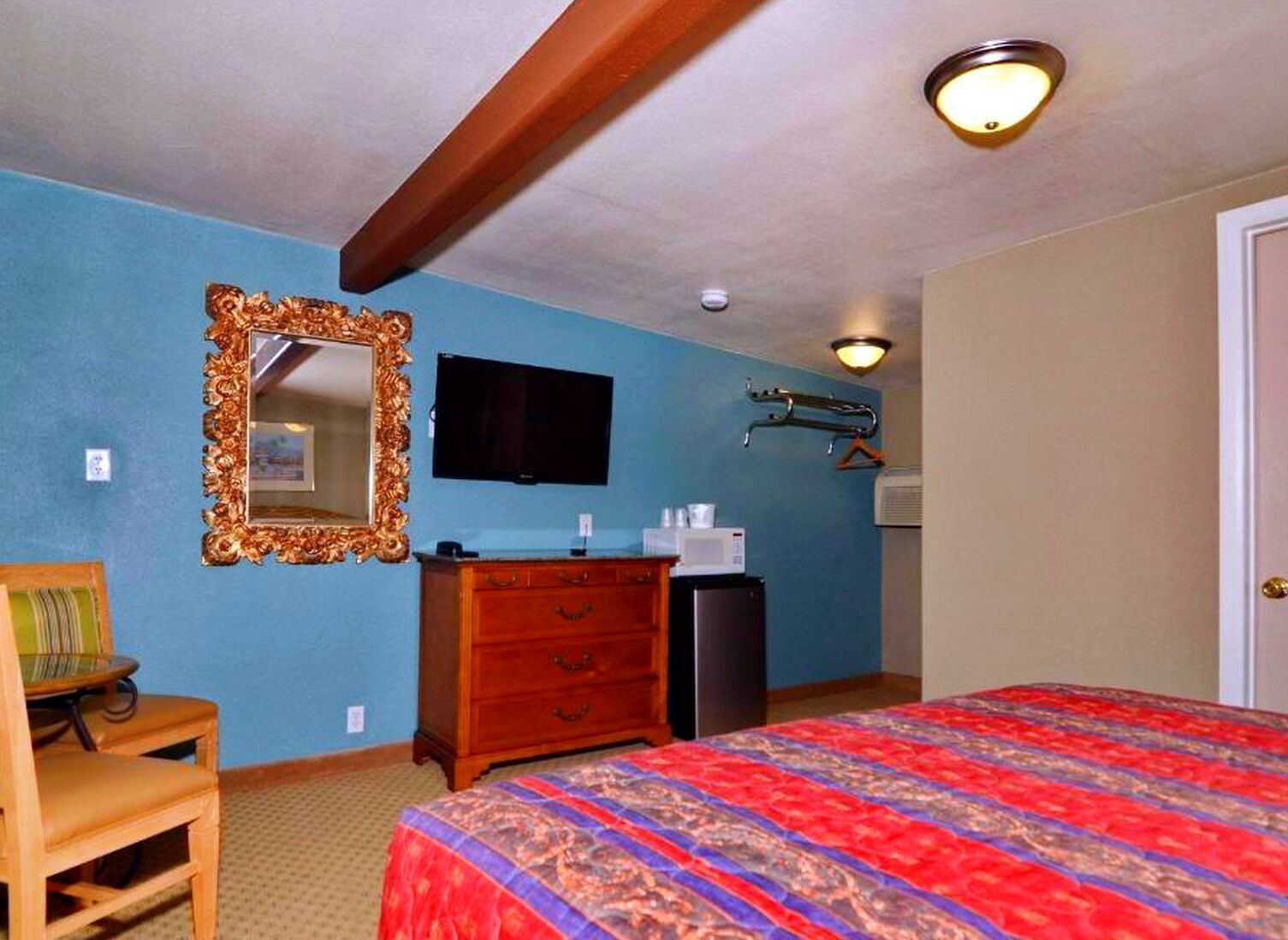 Desk, blackout drapes, iron/ironing board, bed sheets