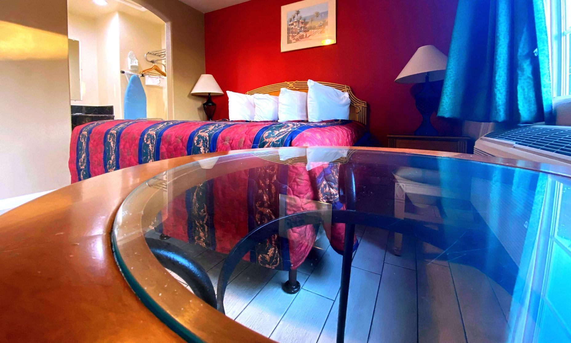 Desk, blackout drapes, iron/ironing board, bed sheets