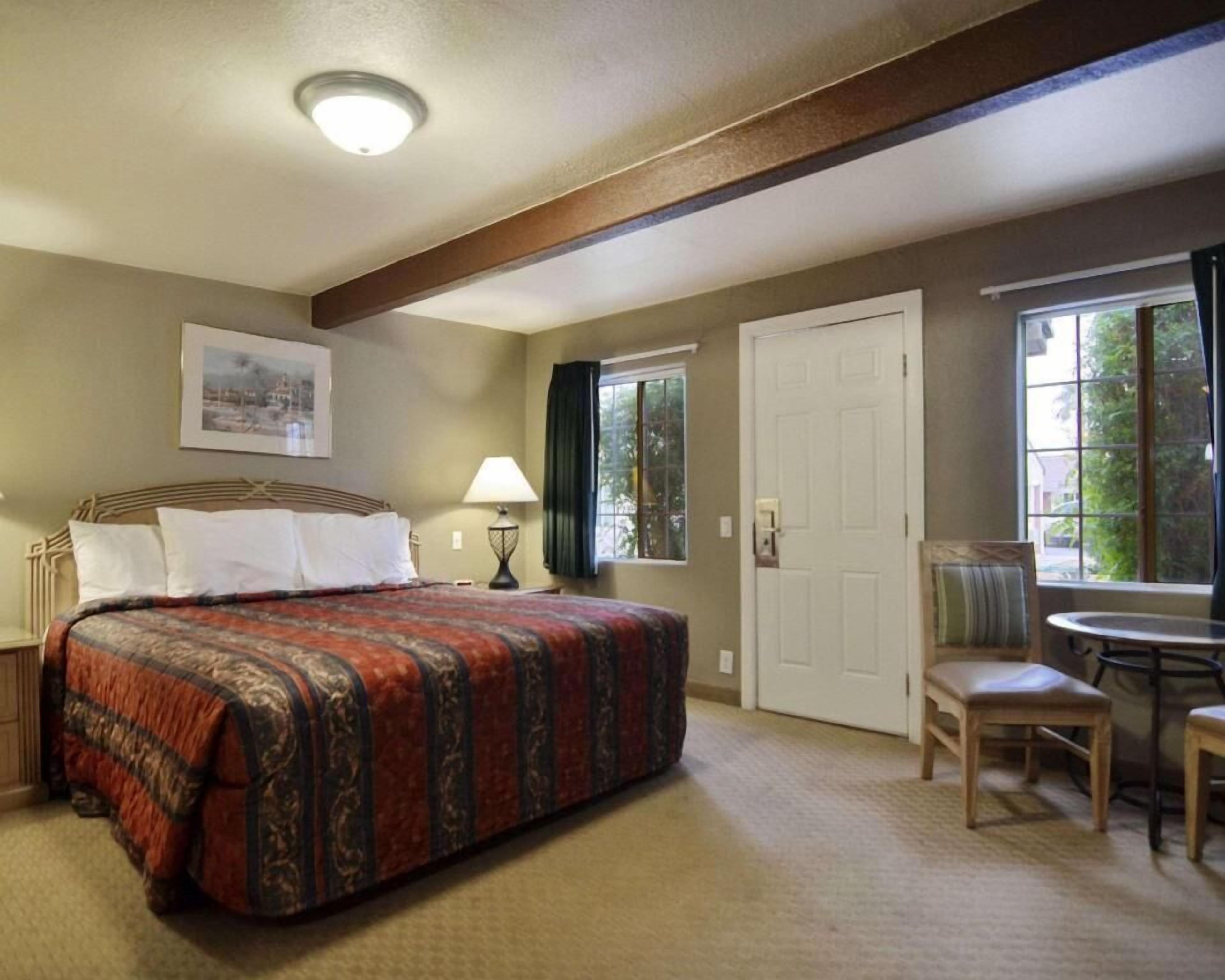 Desk, blackout drapes, iron/ironing board, bed sheets