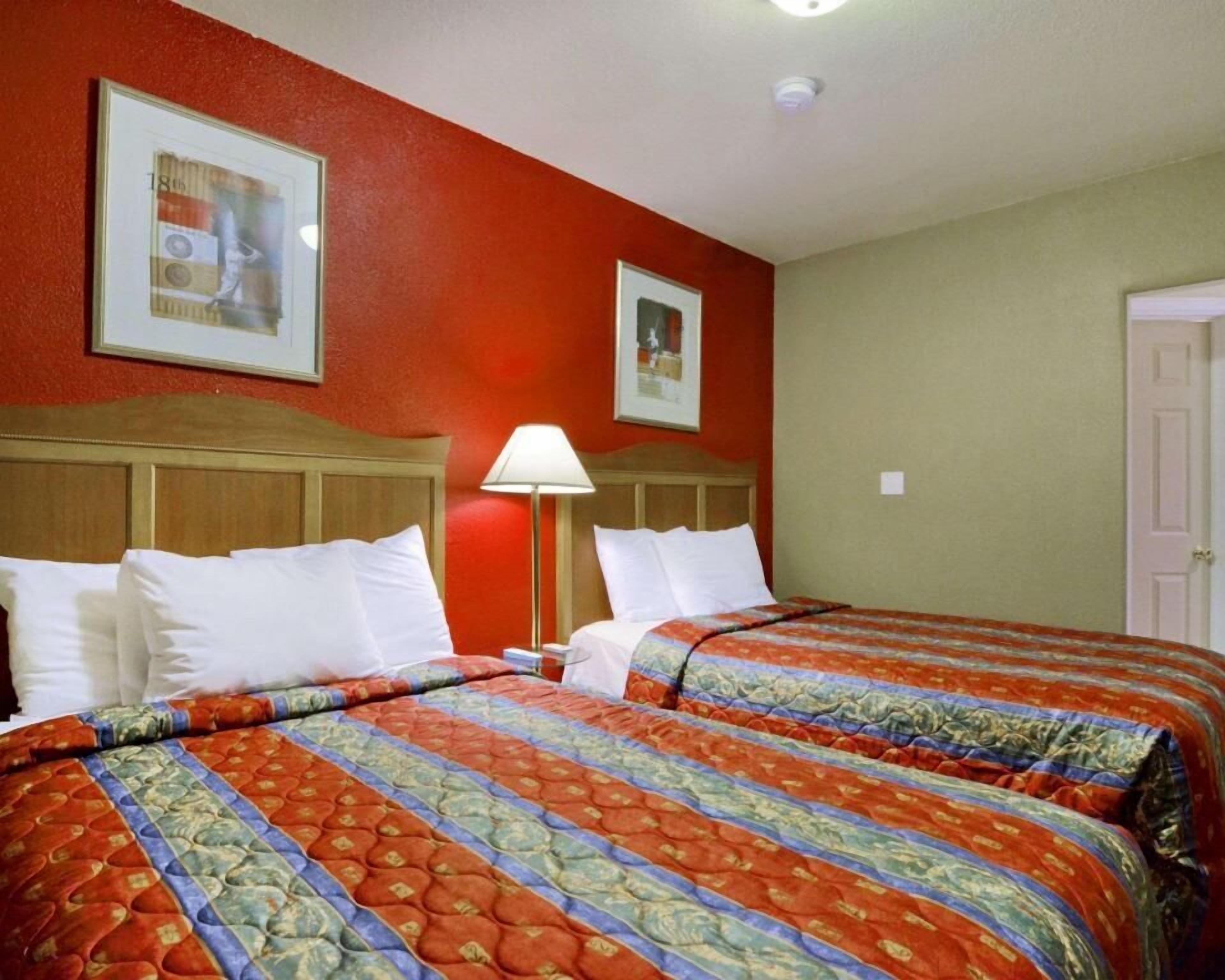 Desk, blackout drapes, iron/ironing board, bed sheets