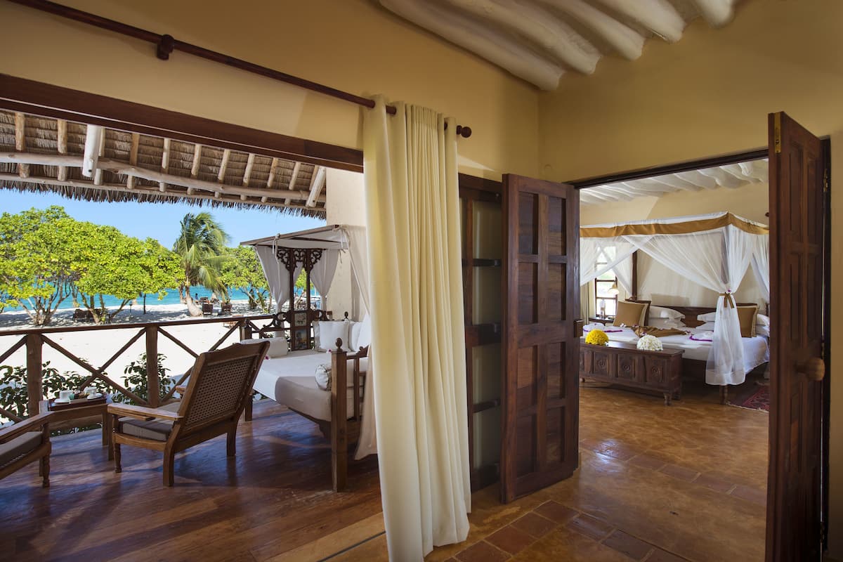 Beach Front Suite | Minibar, in-room safe, blackout curtains, free cots/infant beds