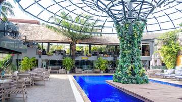 Outdoor pool, open 10:00 AM to 7:00 PM, pool umbrellas, pool loungers