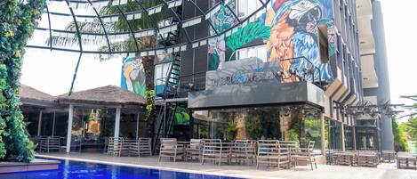 Outdoor pool, open 10:00 AM to 7:00 PM, pool umbrellas, pool loungers