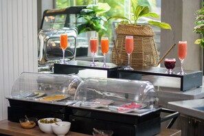 Enjoy a delicious breakfast spread with a variety of fresh fruits, cheeses, and spreads.