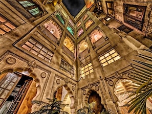 A historic building with multiple arched windows and intricate architectural details.