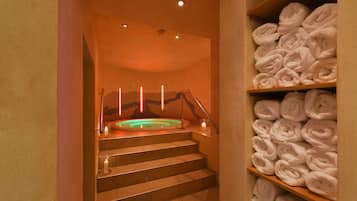 Relax in a warm and inviting space featuring a heated floor bath and convenient storage for your essentials.