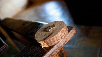 A wooden object with a circular cutout, possibly a part of furniture or a decorative piece.