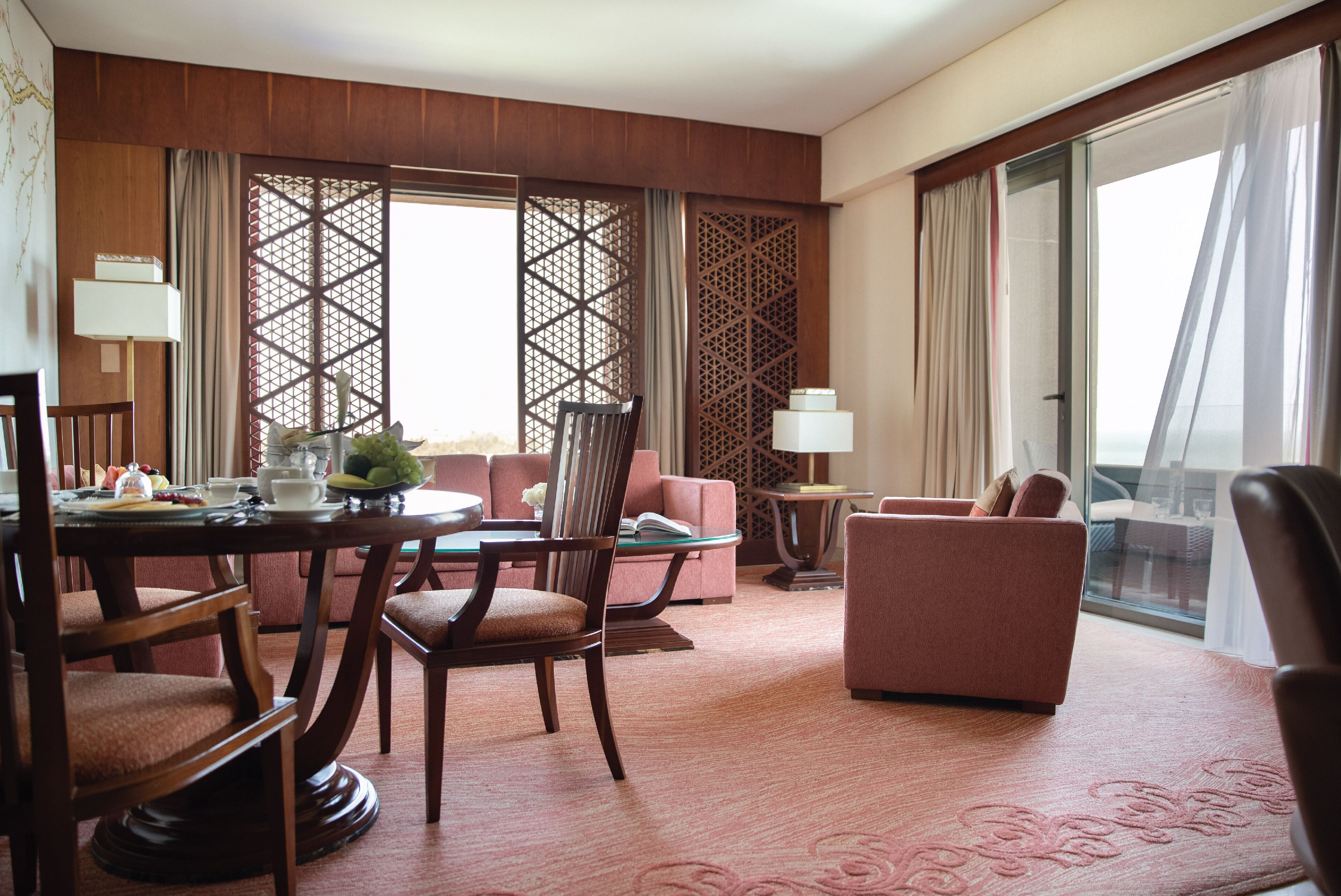 deluxe ocean suite with balcony | living area | 65-inch led tv with cable channels